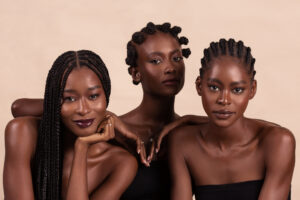 Models Damilola Bolarinde, Eniola Abolarin, and Rebecca Fabunmi, photographed by Remi Adetiba for OLORI Beauty USA's launch campaign